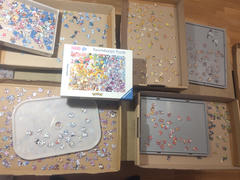 A lot of boxes around and below a Pokemon puzzle box